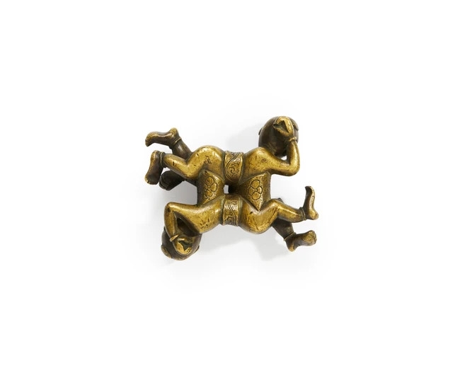 Artwork by Chinese School, A Chinese bronze 'puzzle group' paper weight, Made of Bronze