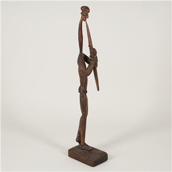 Man med blåsinstrument - Heikki W. Virolainen