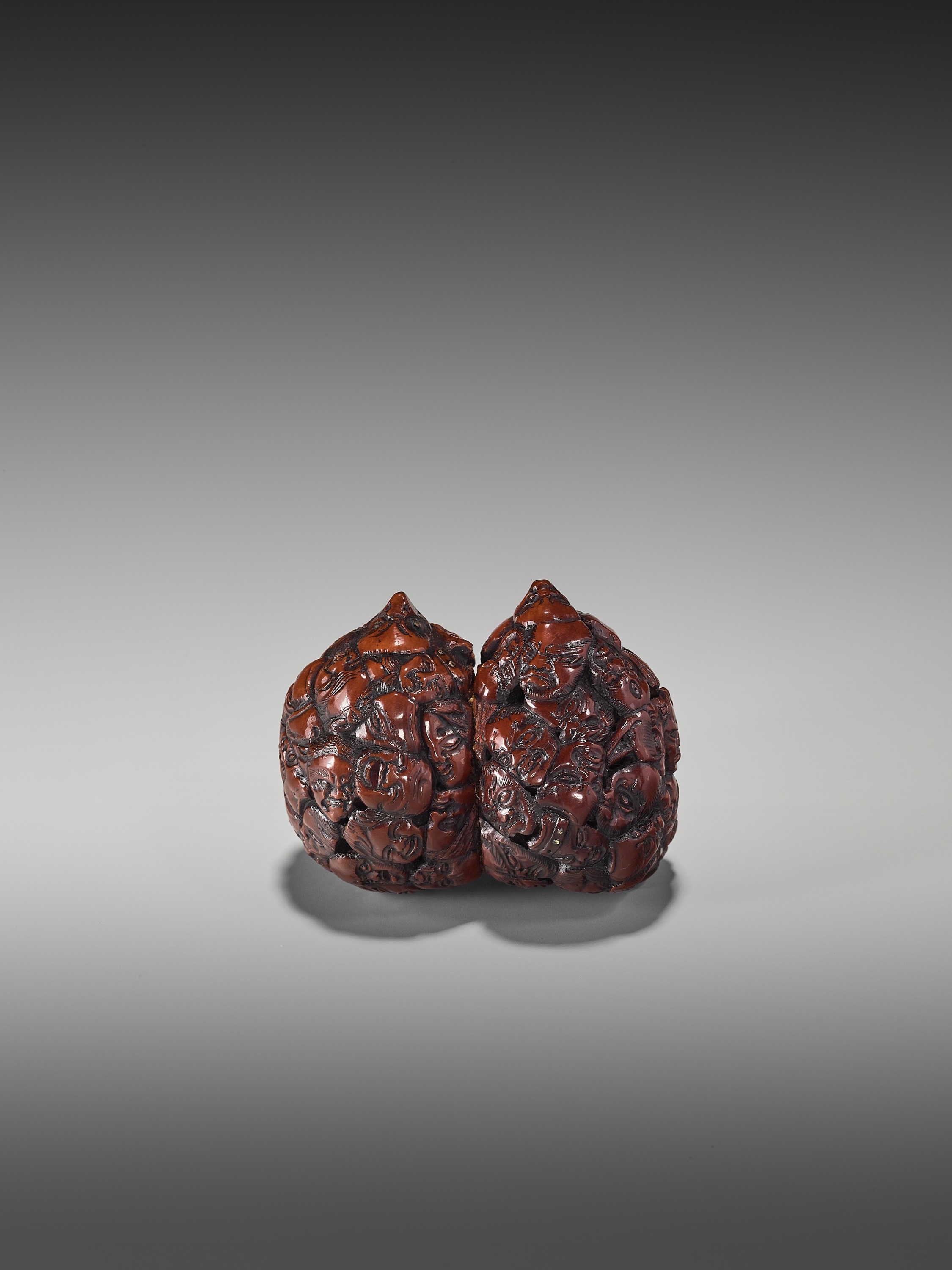 Toryusai Kozan | A RARE DOUBLE NETSUKE WITH A MULTITUDE OF MASK | MutualArt