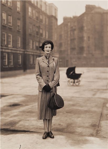 Wenda in a Simpson's Suit, Peabody Trust Buildings, Fulham Road, London, 1949 by Norman Parkinson, 1949