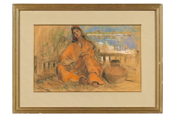 Indian water carrier seated in a city