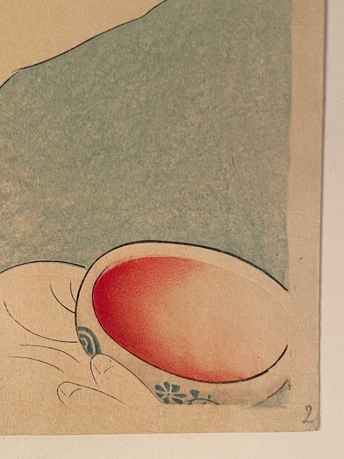 A profile portrait of a woman in traditional Japanese attire holding a small bowl.