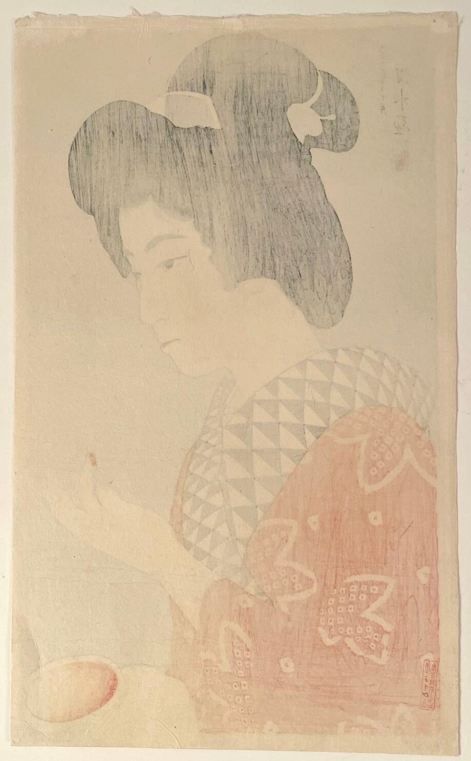 A profile portrait of a woman in traditional Japanese attire holding a small bowl.