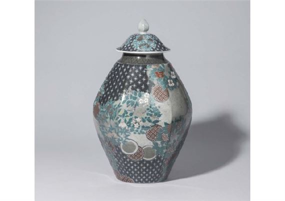 Lidded vase with design of flowering plants of the four seasons in overglaze enamel