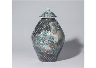Lidded vase with design of flowering plants of the four seasons in overglaze enamel