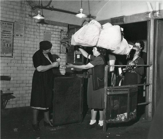 Poinçonneuse de métro, station les Halles, Paris by Robert Doisneau, 1945