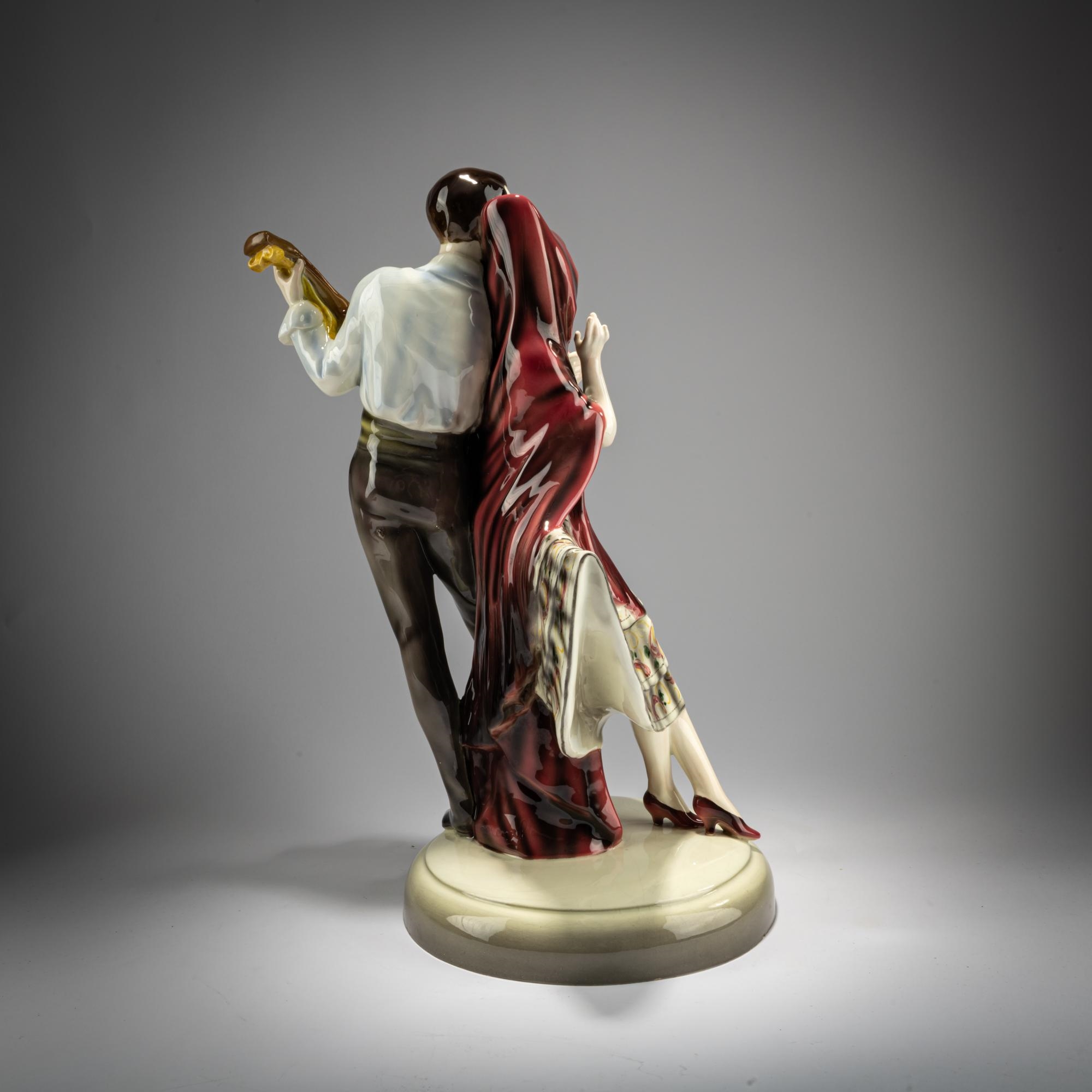 Artwork by Josef Lorenzl, Group of standing dancer in fan-shaped dress, behind her a man with a violin, Made of Earthenware, Polychrome Glaze