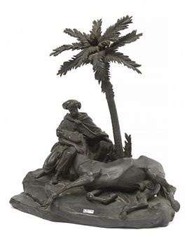 a bronze sculpture of a man on a horse next to a palm tree