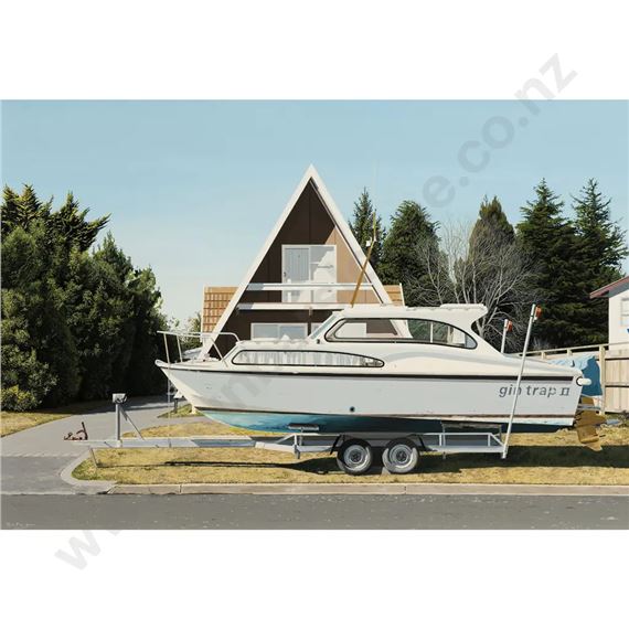 A white boat sits on a trailer in front of an A-frame house.