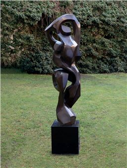 A large metal sculpture sitting on top of a black block.