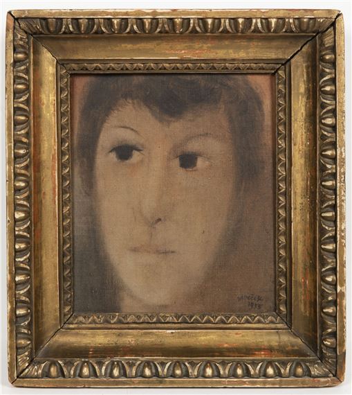 A painting of a woman's face in a gold frame.