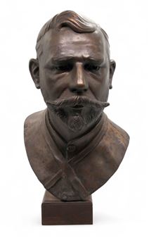 A bronze bust of a bearded man in a military uniform.