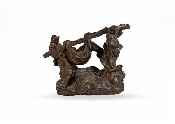 a bronze sculpture of a man and a woman on a rock
