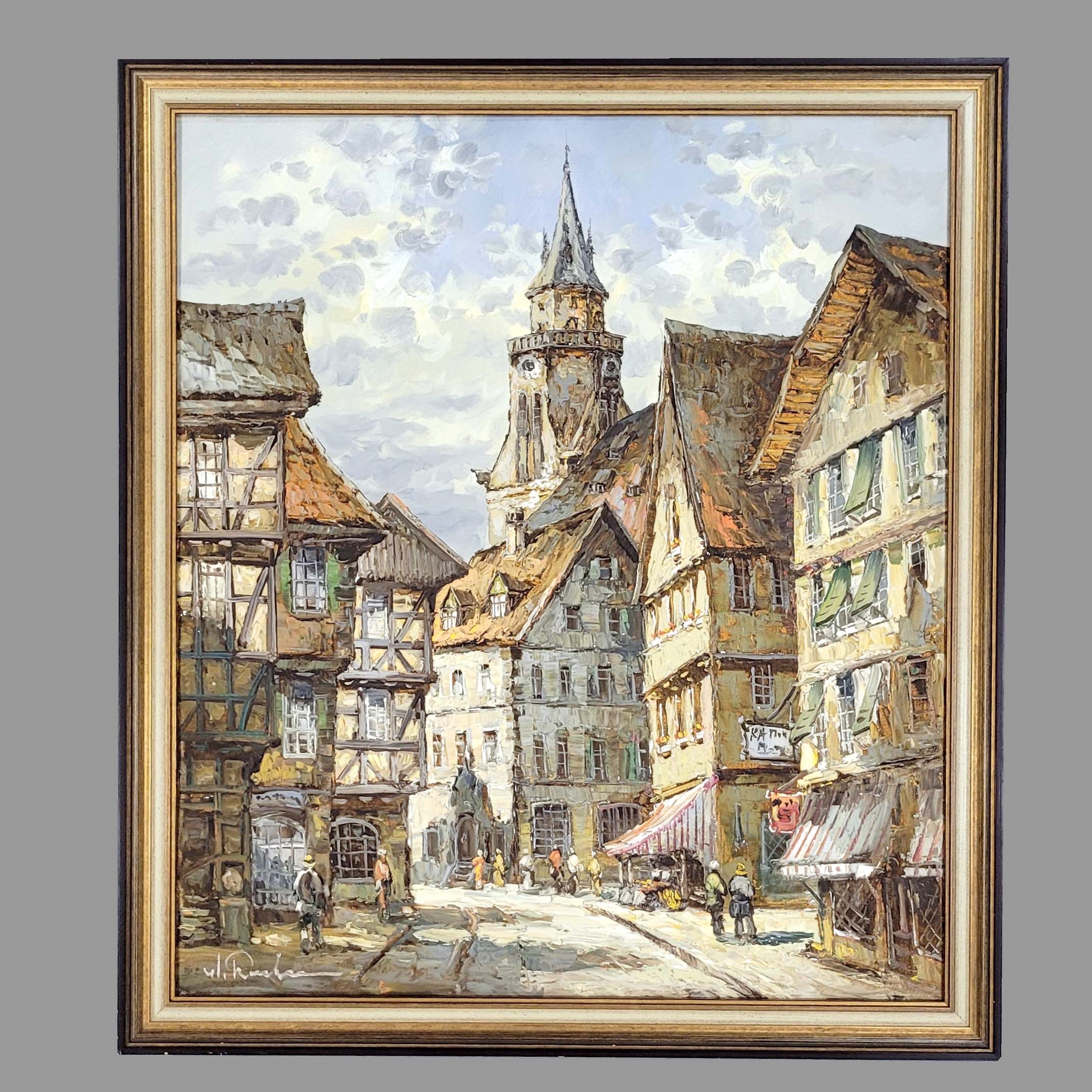 A sun-drenched European street scene featuring half-timbered buildings and a church tower.