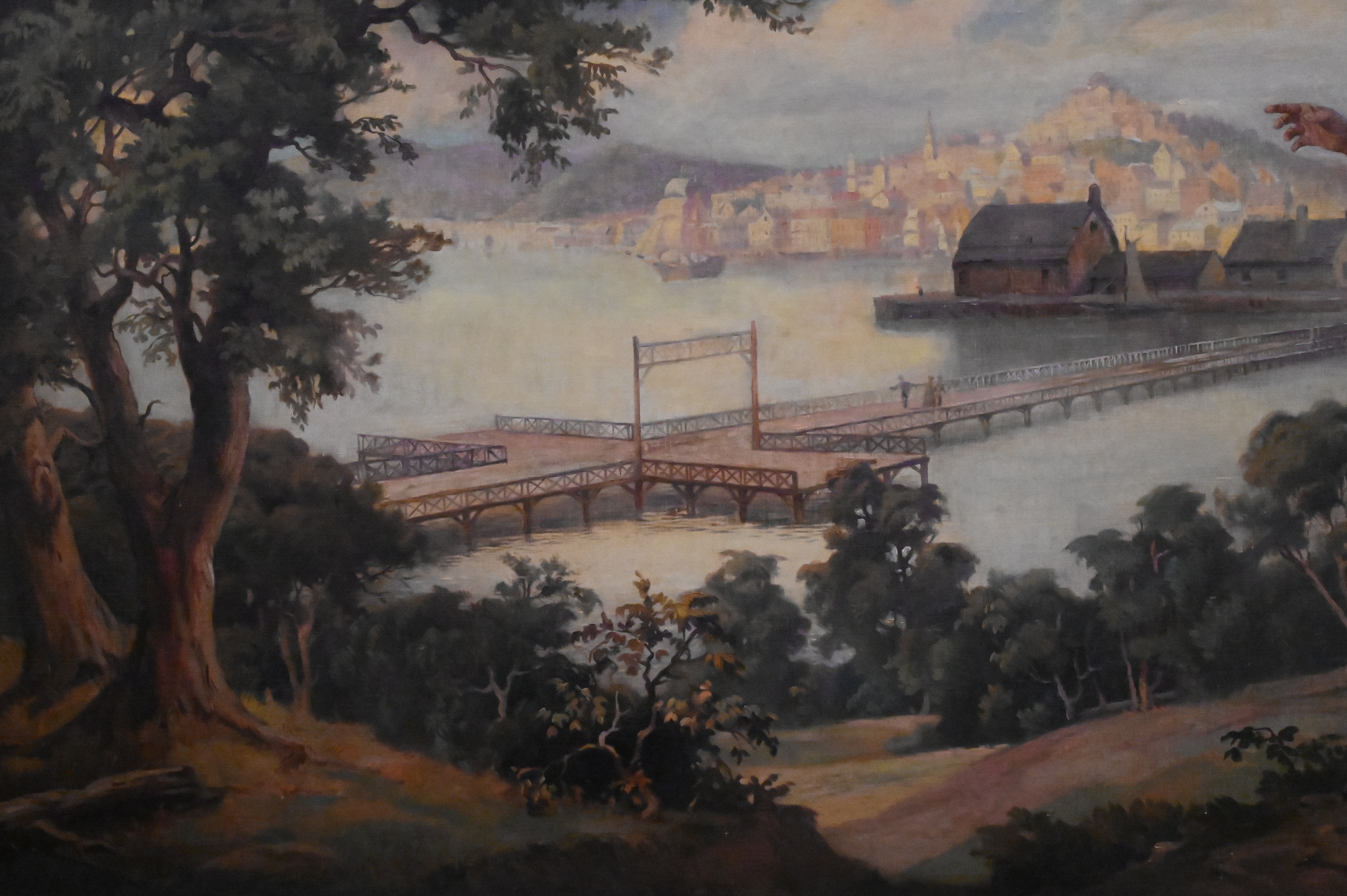 A romanticized landscape painting featuring a couple gazing at a distant city from a hillside.