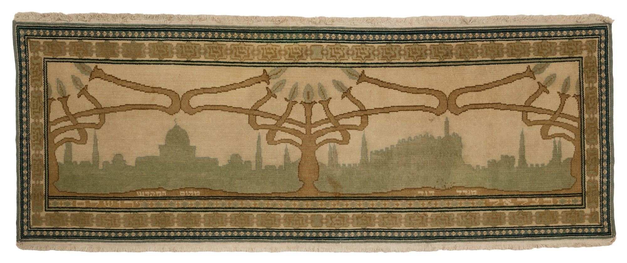 Bezalel school, 20th century | A Bezalel Wool Carpet with Menorot and ...