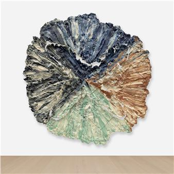 A large piece of art on a wall in a room.