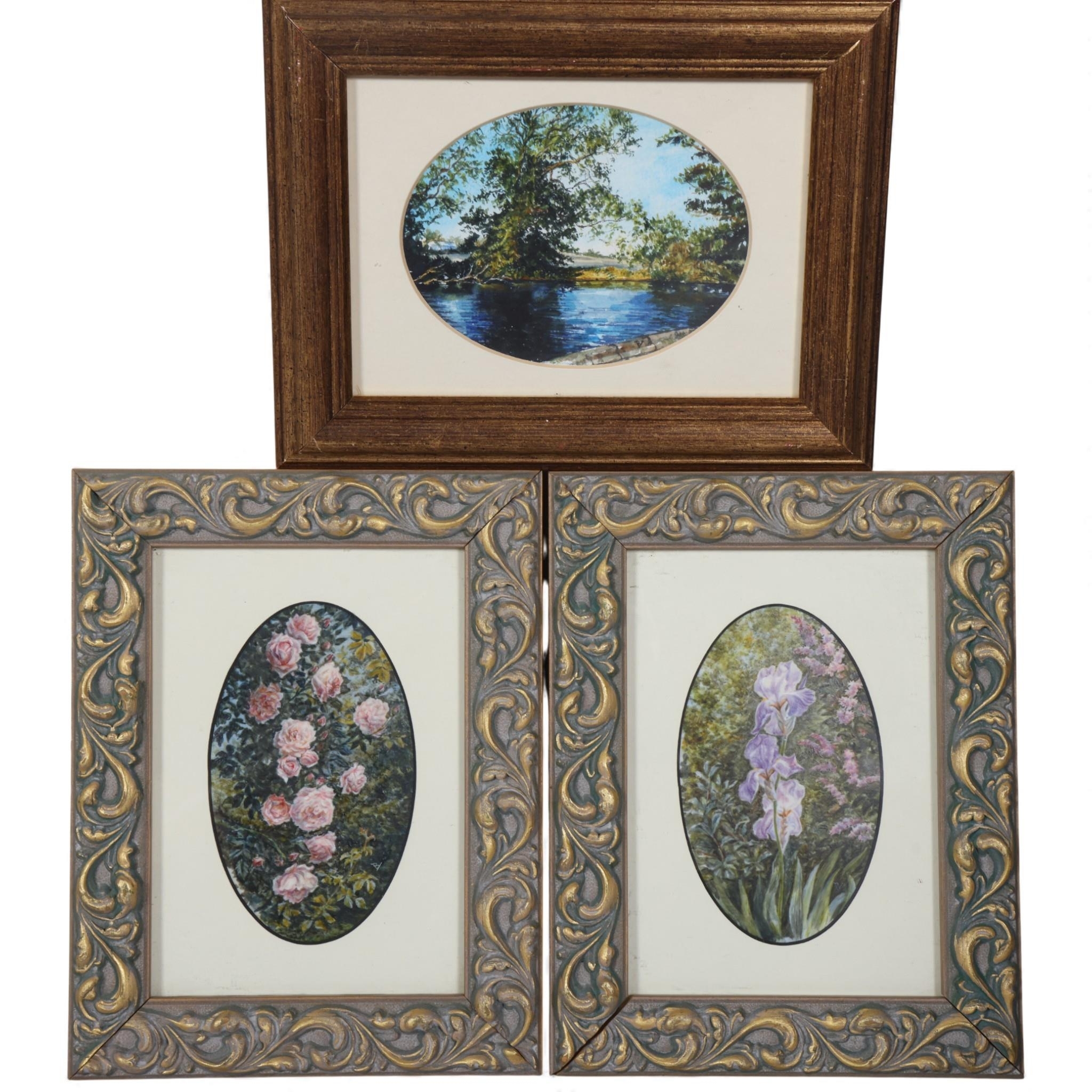 A set of three framed botanical and landscape prints arranged in a triangular composition.