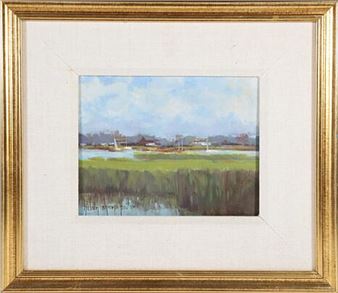 A framed impressionist landscape painting of a marshy shoreline with distant buildings under a cloudy sky.