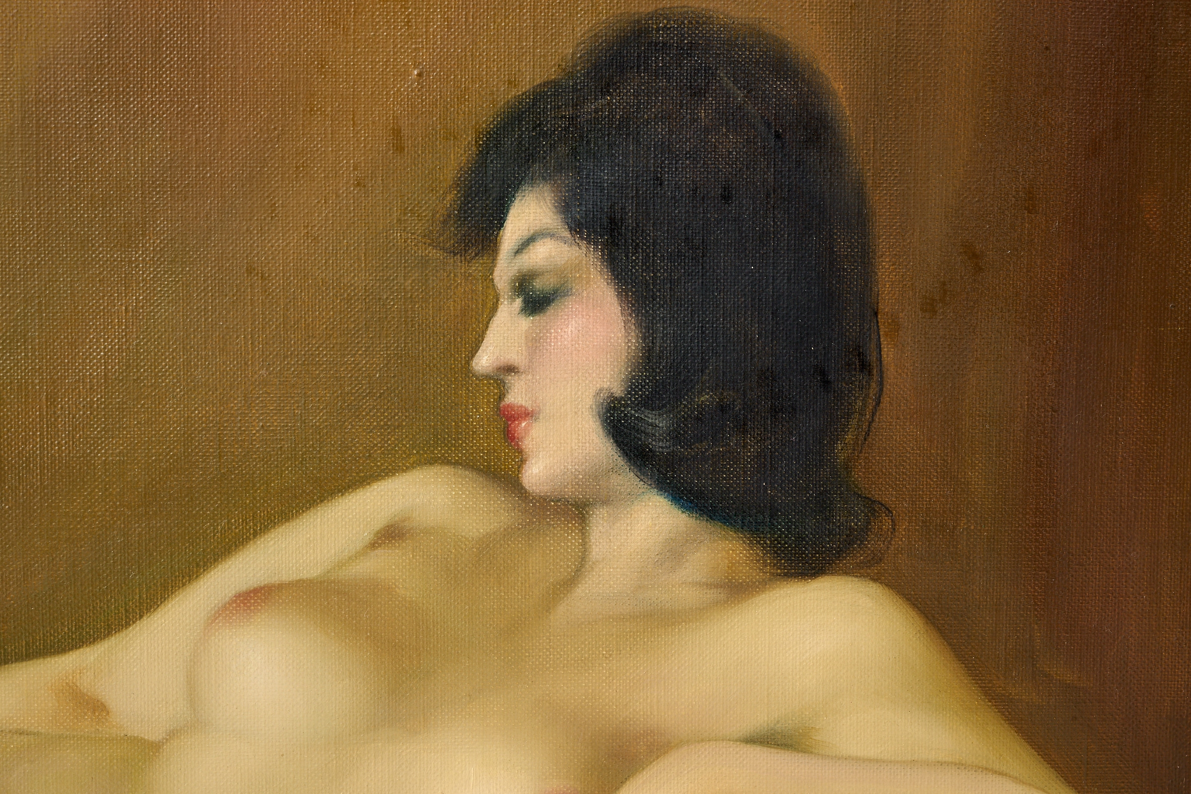 A classical oil painting of a reclining nude figure in a bed, framed in ornate gold.