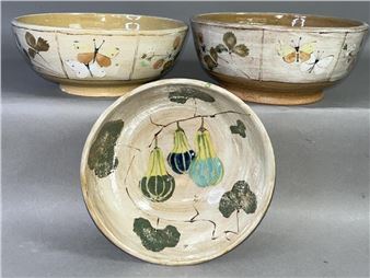 A group of three bowls sitting on top of a table.