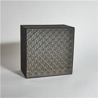 A black and silver cabinet with a pattern on it.