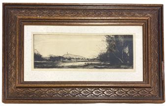 A black and white drawing of a landscape in a wooden frame.