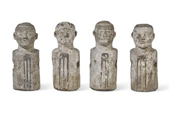 FOUR CARVED STONE HEADS