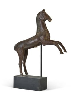 A CARVED AND PAINTED CAROUSEL HORSE