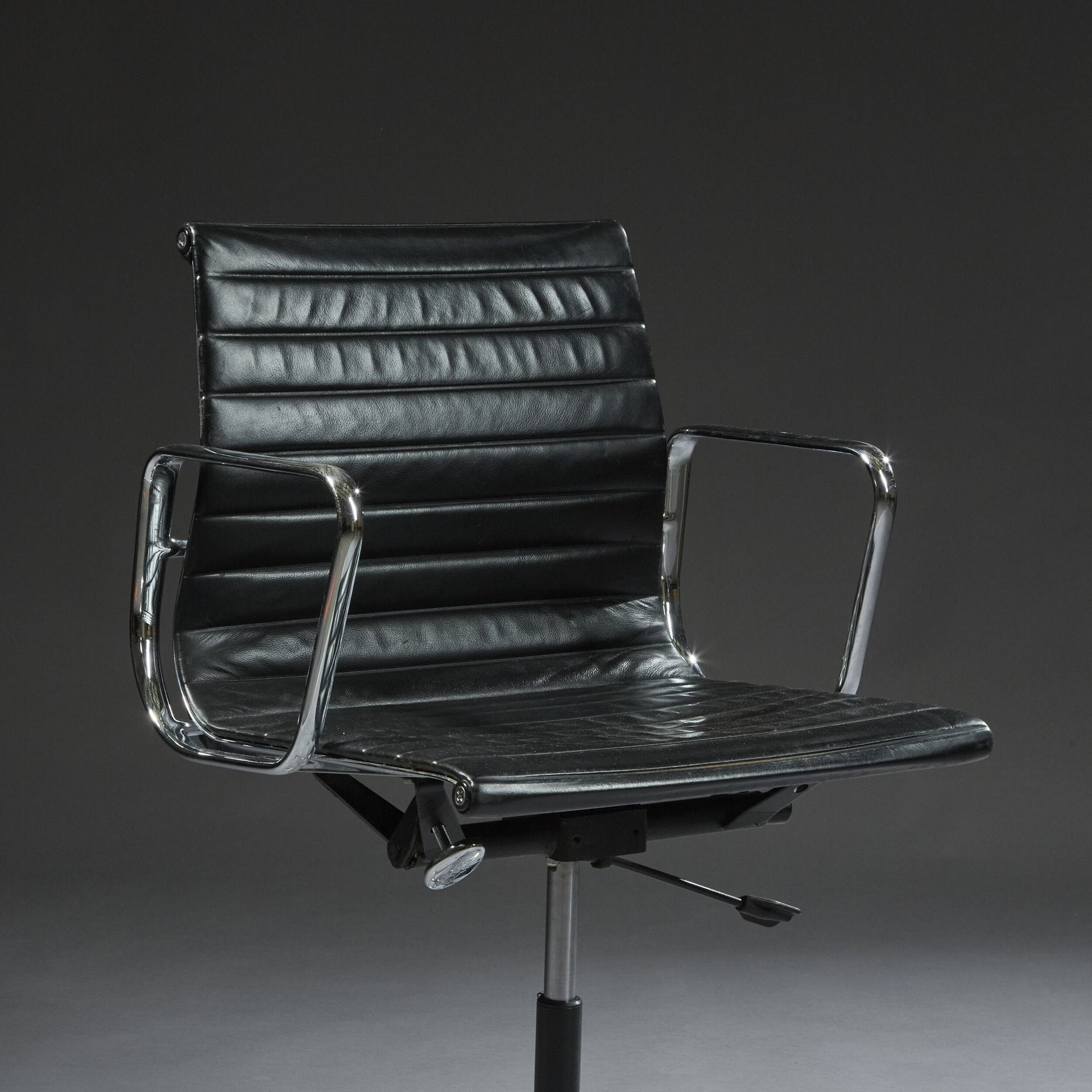 Charles & Ray Eames | Seat in cast aluminum and black leather, model ...