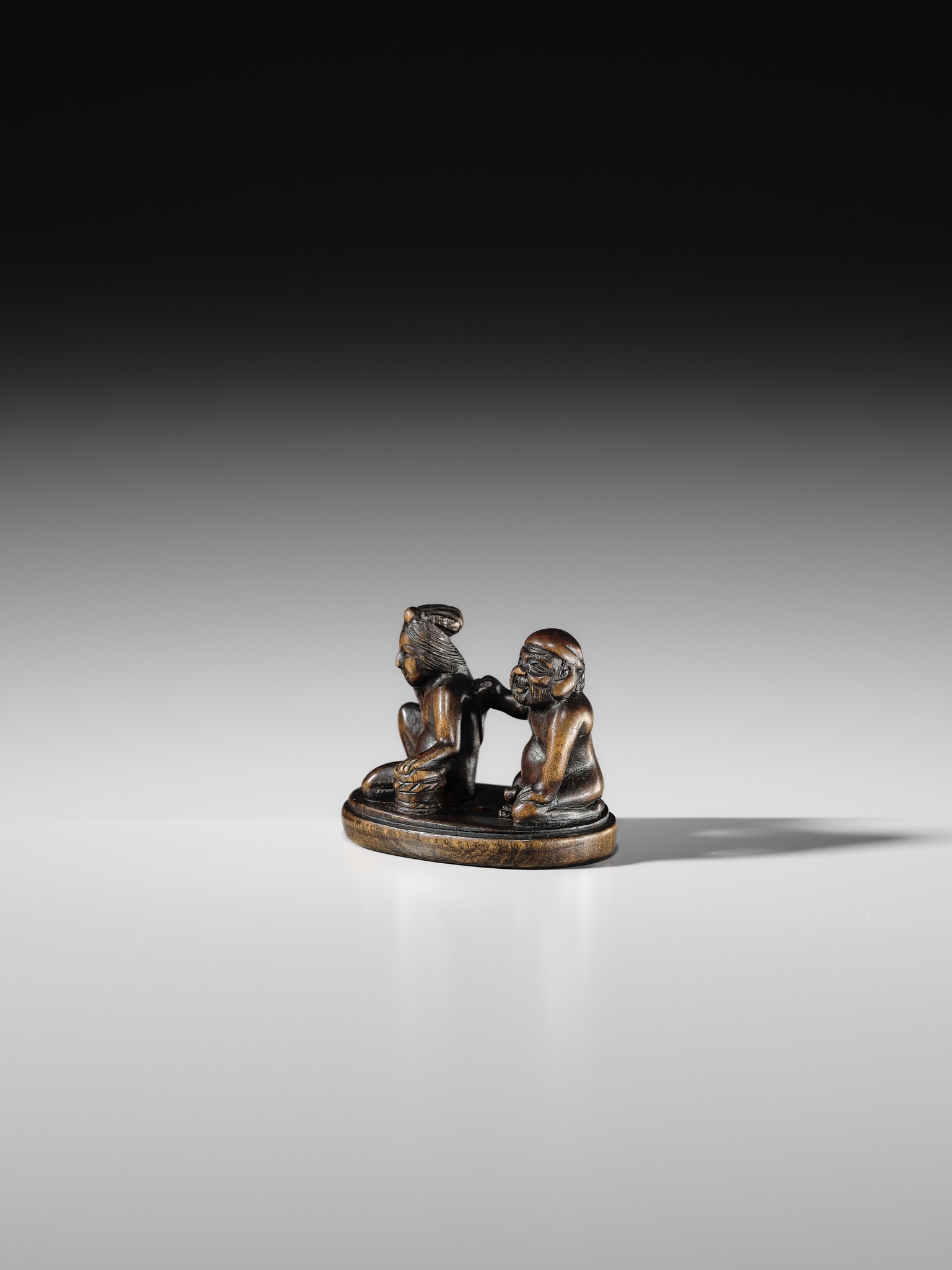 Japanese School, 19th Century | AN AMUSING SHUNGA WOOD NETSUKE OF EBISU ...