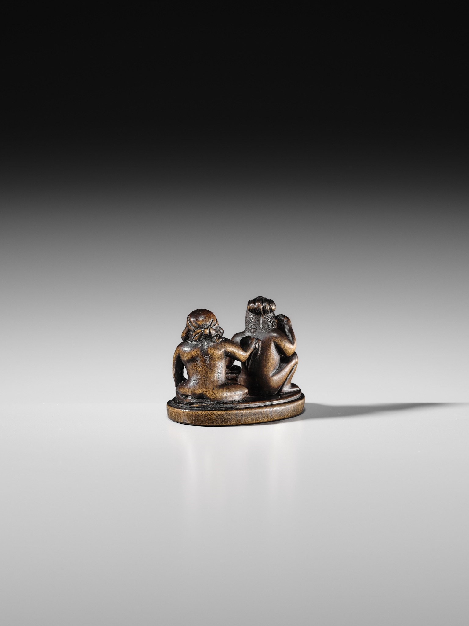 Japanese School, 19th Century | AN AMUSING SHUNGA WOOD NETSUKE OF EBISU ...