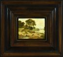 A small framed landscape painting depicting a serene river scene with trees and a distant figure.