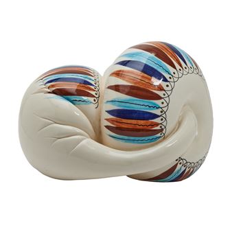 A ceramic sculpture shaped like a heart, featuring a glossy white base and colorful striped patterns.