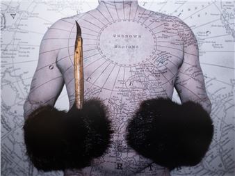 A surreal portrait of a torso with fur-covered hands and a quill pen against an old map background.