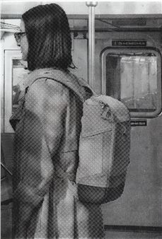 A black and white photo of a woman with a backpack.