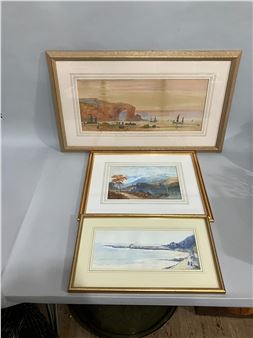 A collection of three framed landscape watercolors featuring coastal and mountain scenes.