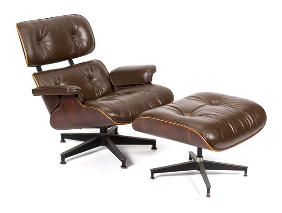 A classic lounge chair and ottoman set featuring brown leather upholstery and a star base.