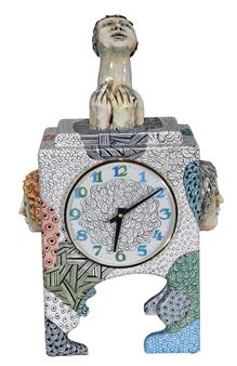 A clock with a statue of a woman on top of it.