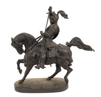 A bronze statue of a man on a horse holding a spear.