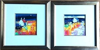 A couple of framed paintings hanging on a wall.