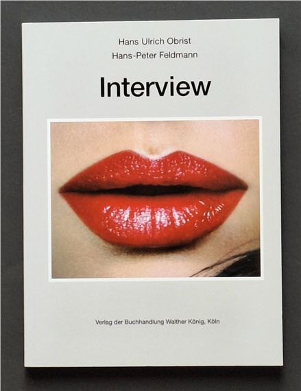 A minimalist book cover featuring bold typography and a close-up of glossy red lips.