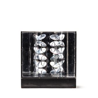 A black and silver sculpture on a white background.