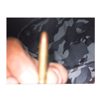 A person holding a pencil in their hand. 