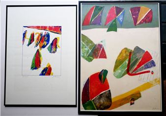 A couple of paintings hanging on a wall next to each other.