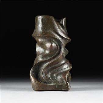 A bronze sculpture on a white surface with a black background.