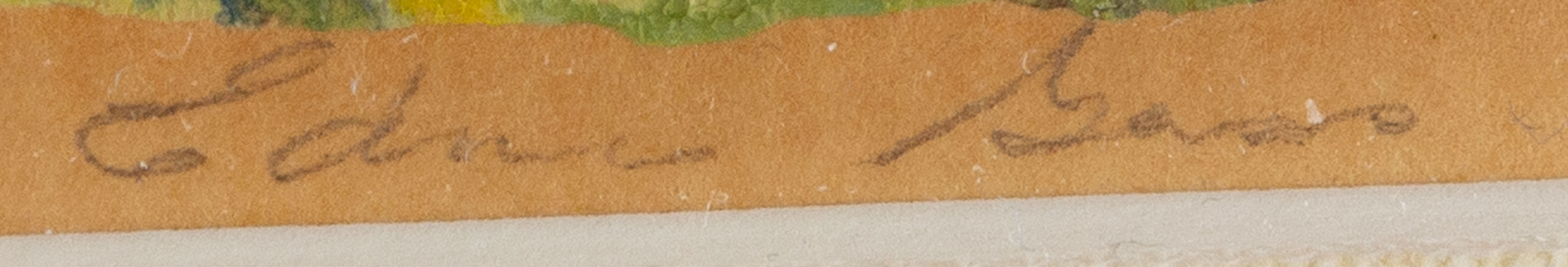 A small framed landscape painting of a village nestled in rolling hills.