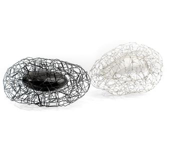 A minimalist composition featuring two wireframe bowls, one black and one silver, set against a stark white background.