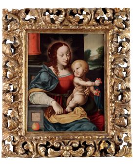 A classical religious painting of a seated figure holding a child, framed in ornate gold.