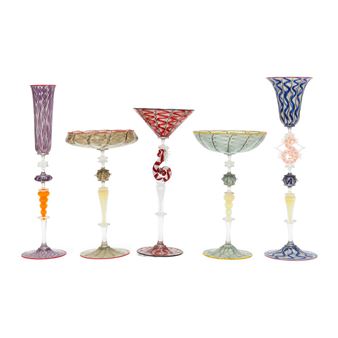 A set of five colorful glass goblets with intricate patterns and seahorse details.